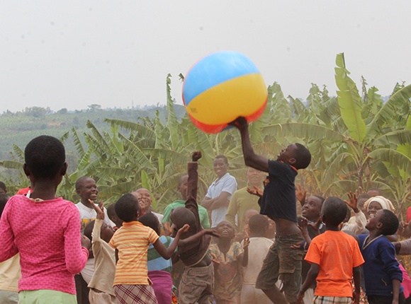 Photo of Rwandan children playing with a big beach ball