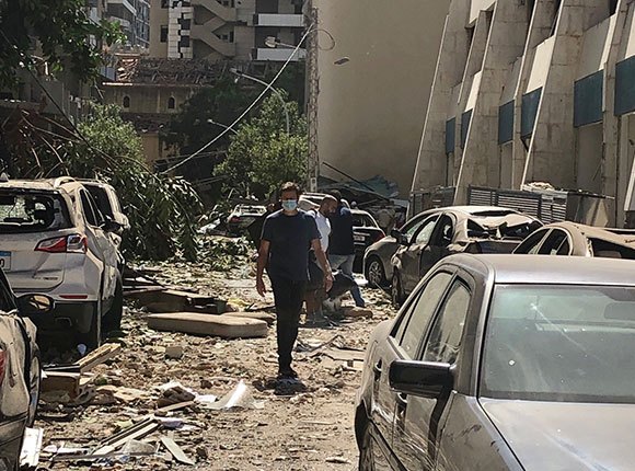 Photo of a man amid the rubble after the Beirut blast