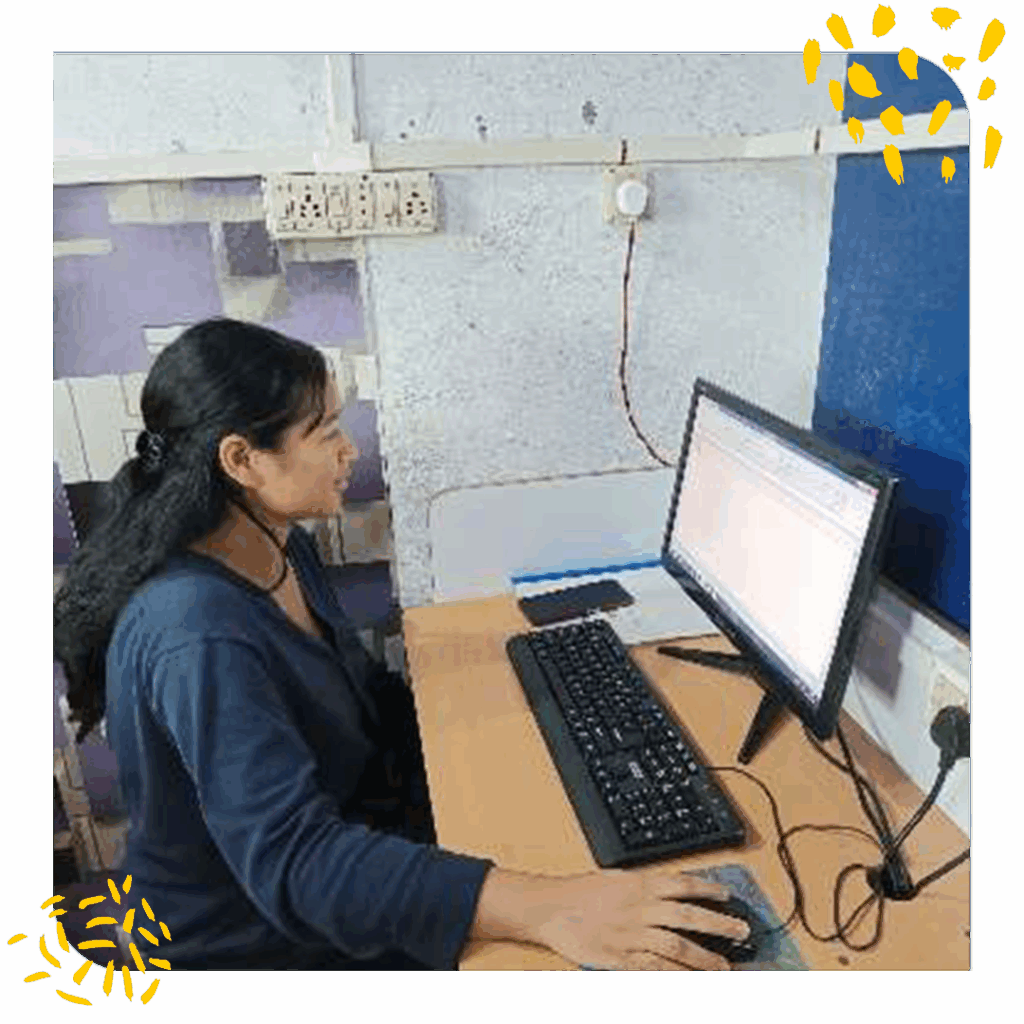 A young woman uses a computer as part of a job skills training